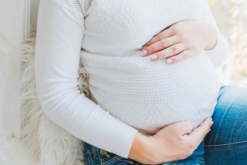 Pregnant woman illustrating CBD precautions during pregnancy and breastfeeding