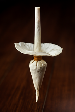 CBD tulip joint, advanced rolling technique on dark background